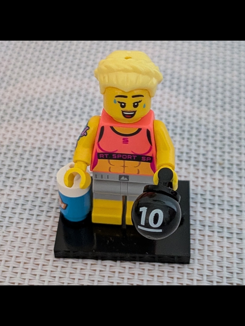 LEGO Female Minifigure with Kettlebell - Pink Top - Series 25
